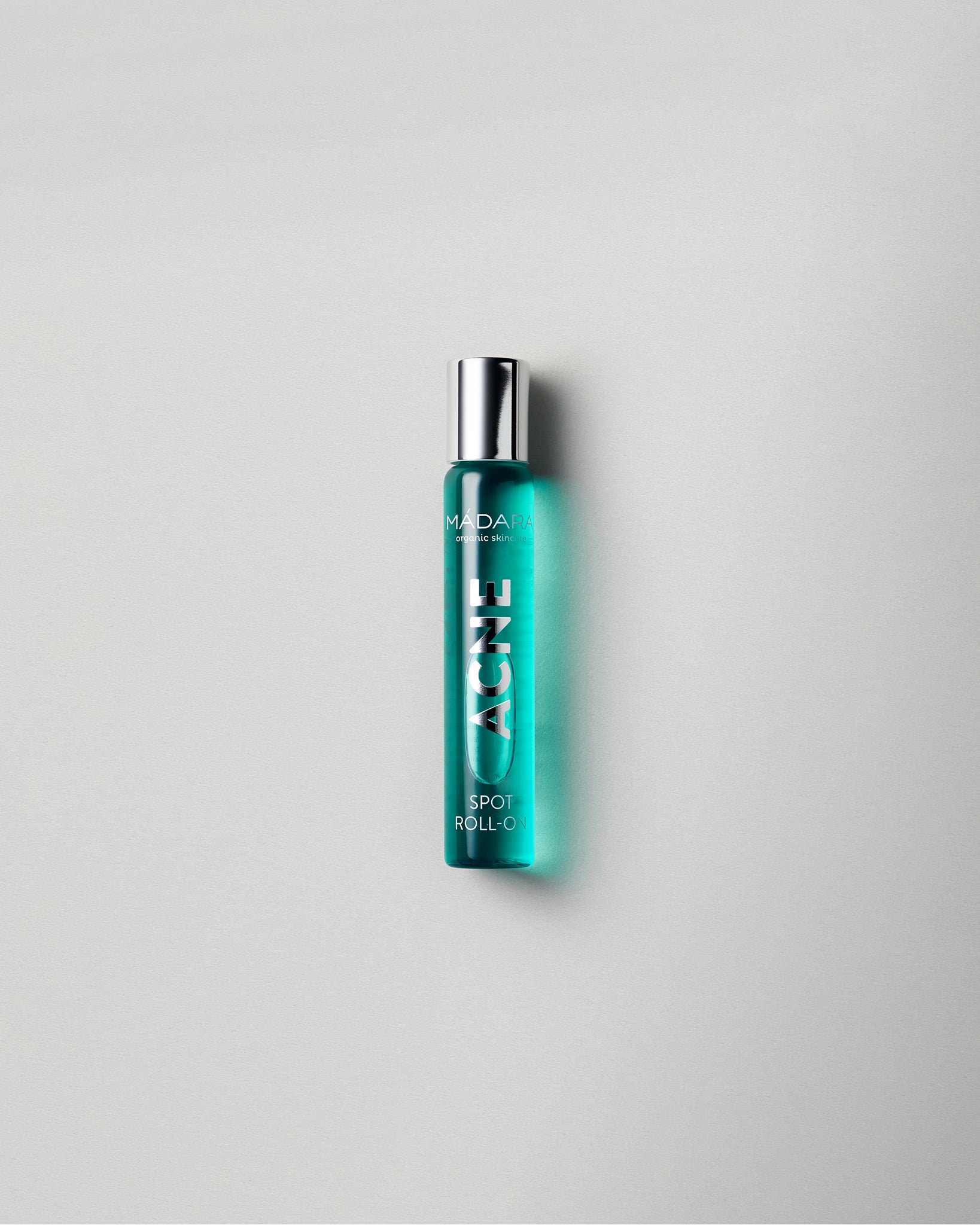 MรDARA Organic Skincare acne spot roll on A2103 product photo on plain background.