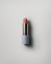 MÁDARA Organic Skincare matte cream lipstick dark nude A6305 face cream product photo on plain background.