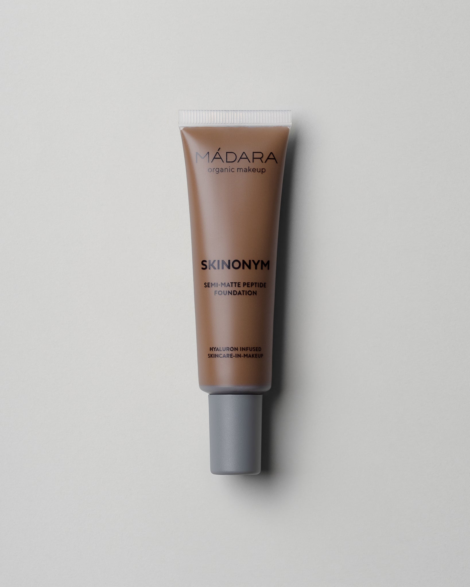 MÁDARA Organic Skincare skinonym foundation fudge A6095 foundation product photo on plain background.