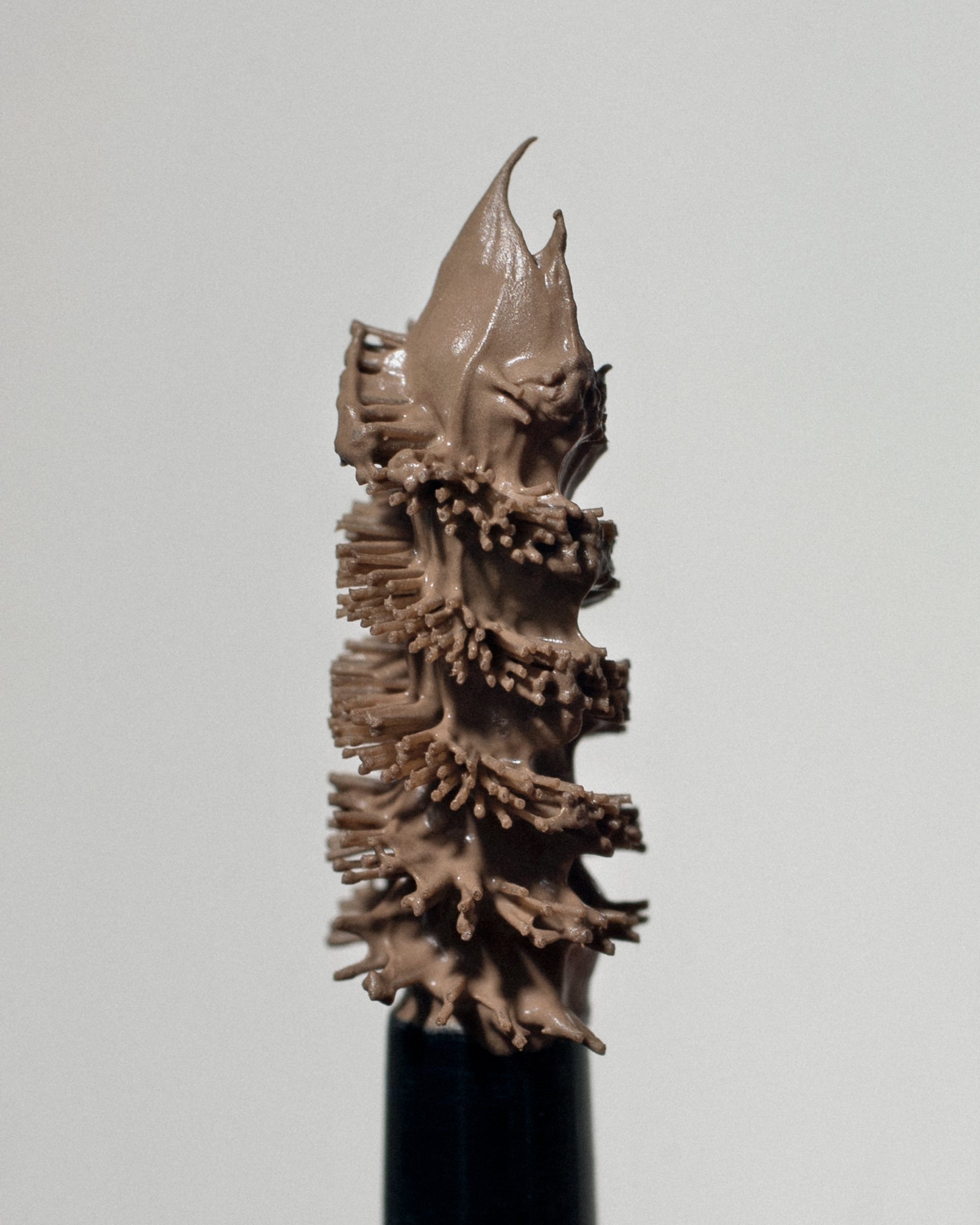 Texture close-up of MÁDARA Organic Skincare grow and fix smoky blonde A6702 �swatch demonstrates consistency and finish.