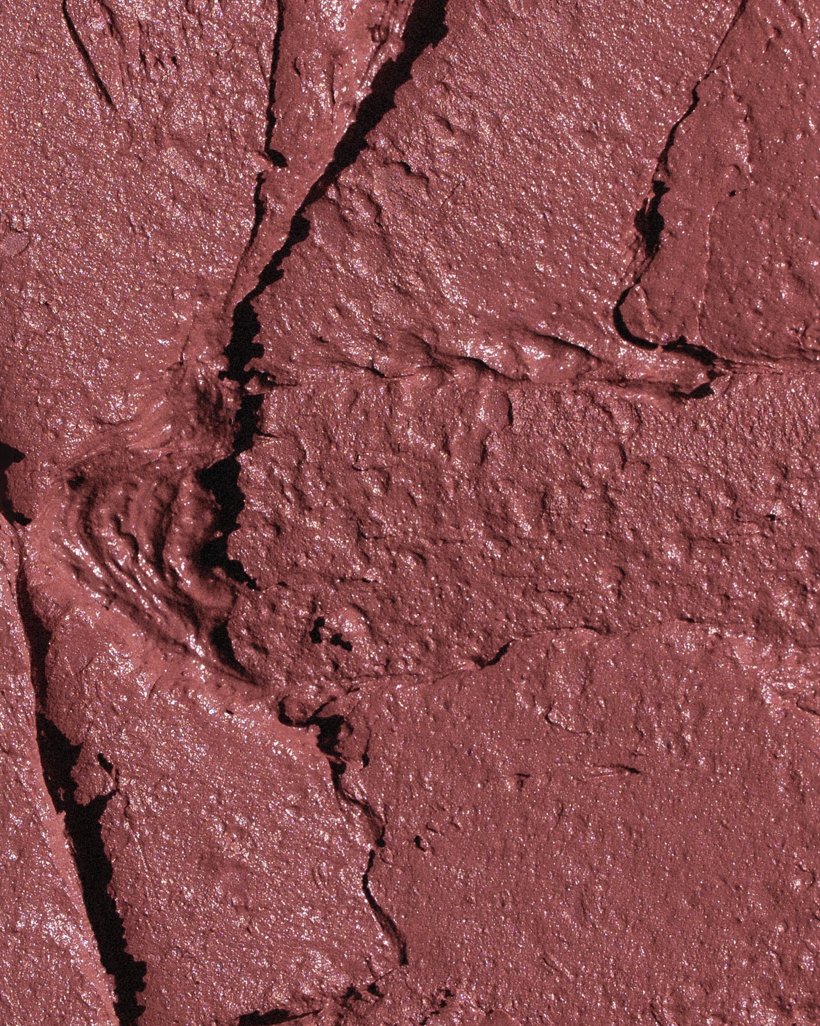 Texture close-up of MÁDARA Organic Skincare satin shine lipstick charisma A6503 �swatch demonstrates consistency and finish.
