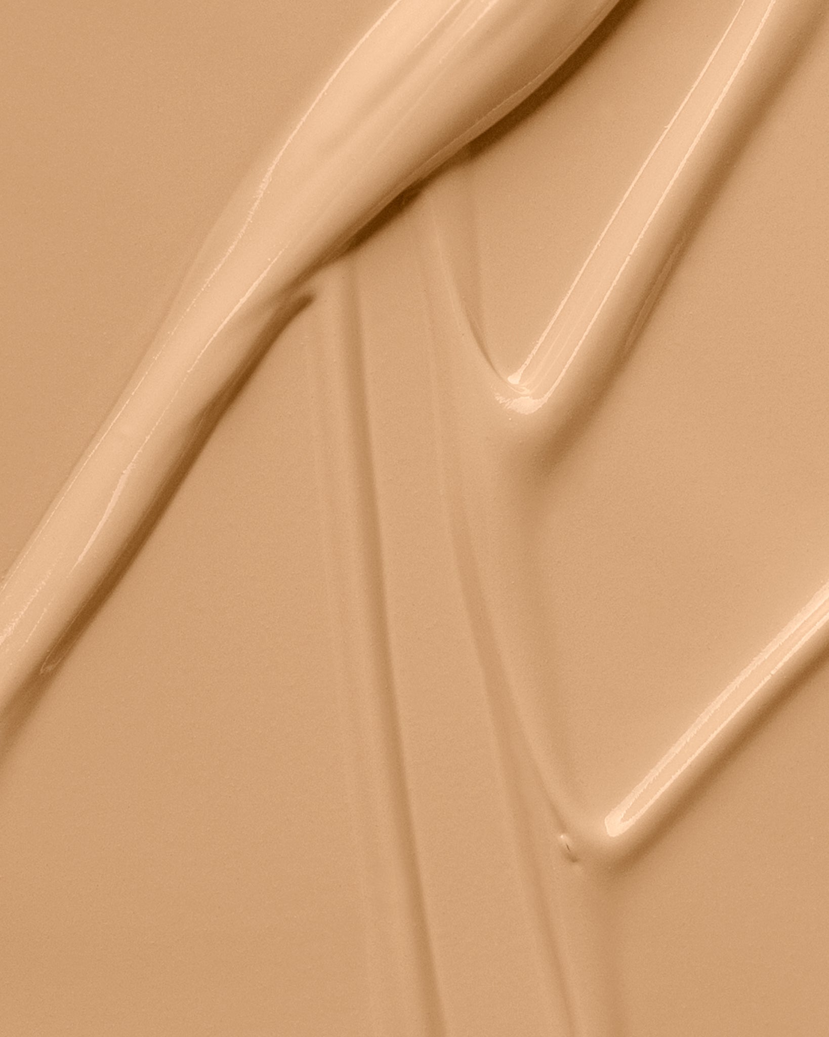 Texture close-up of MÁDARA Organic Skincare skinonym sand A6085 �swatch demonstrates consistency and finish.