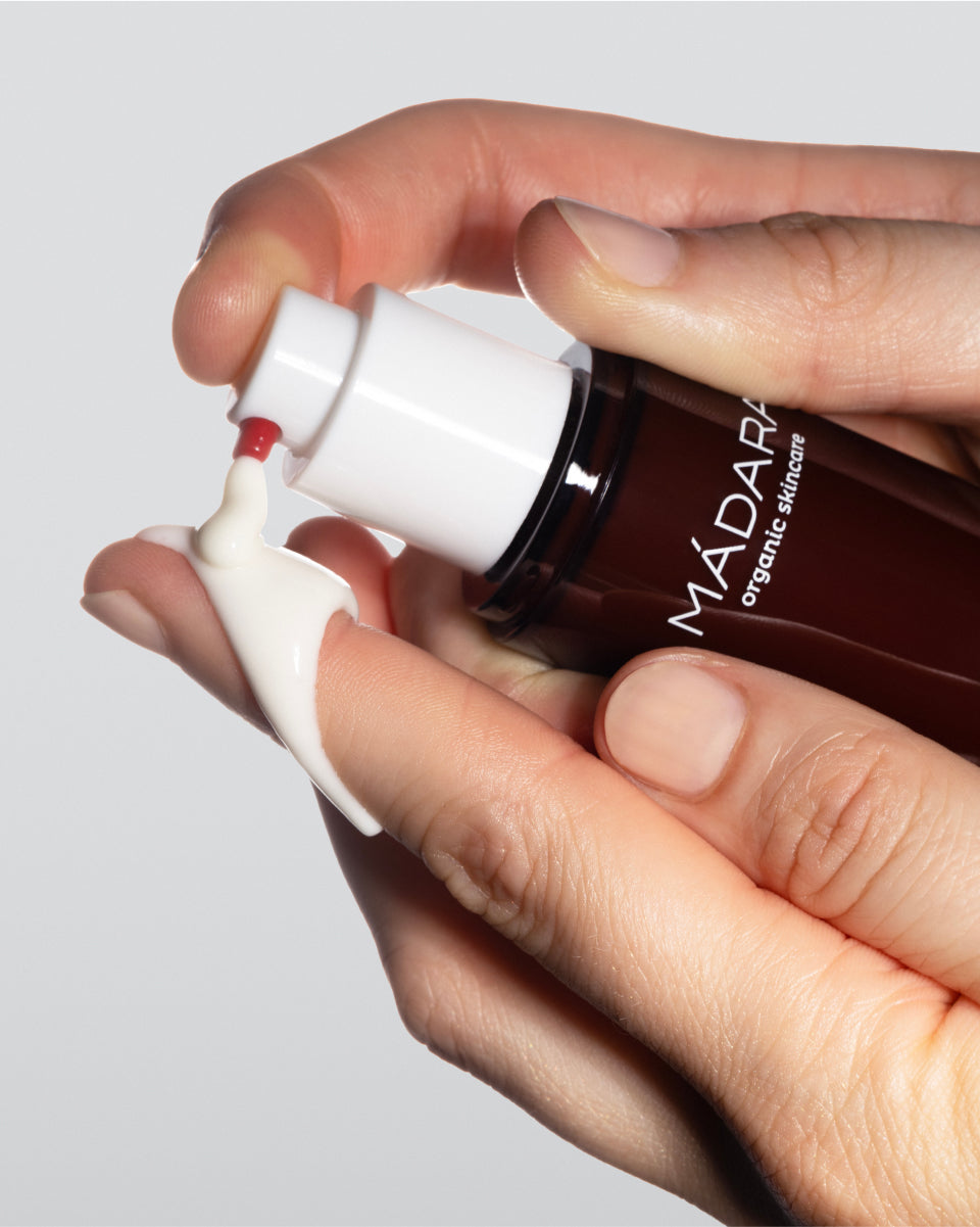 Applying MÁDARA Derma Collagen Peptide Day Cream — hydrating organic face moisturizer with peptides for plump, voluminous, and supple skin
