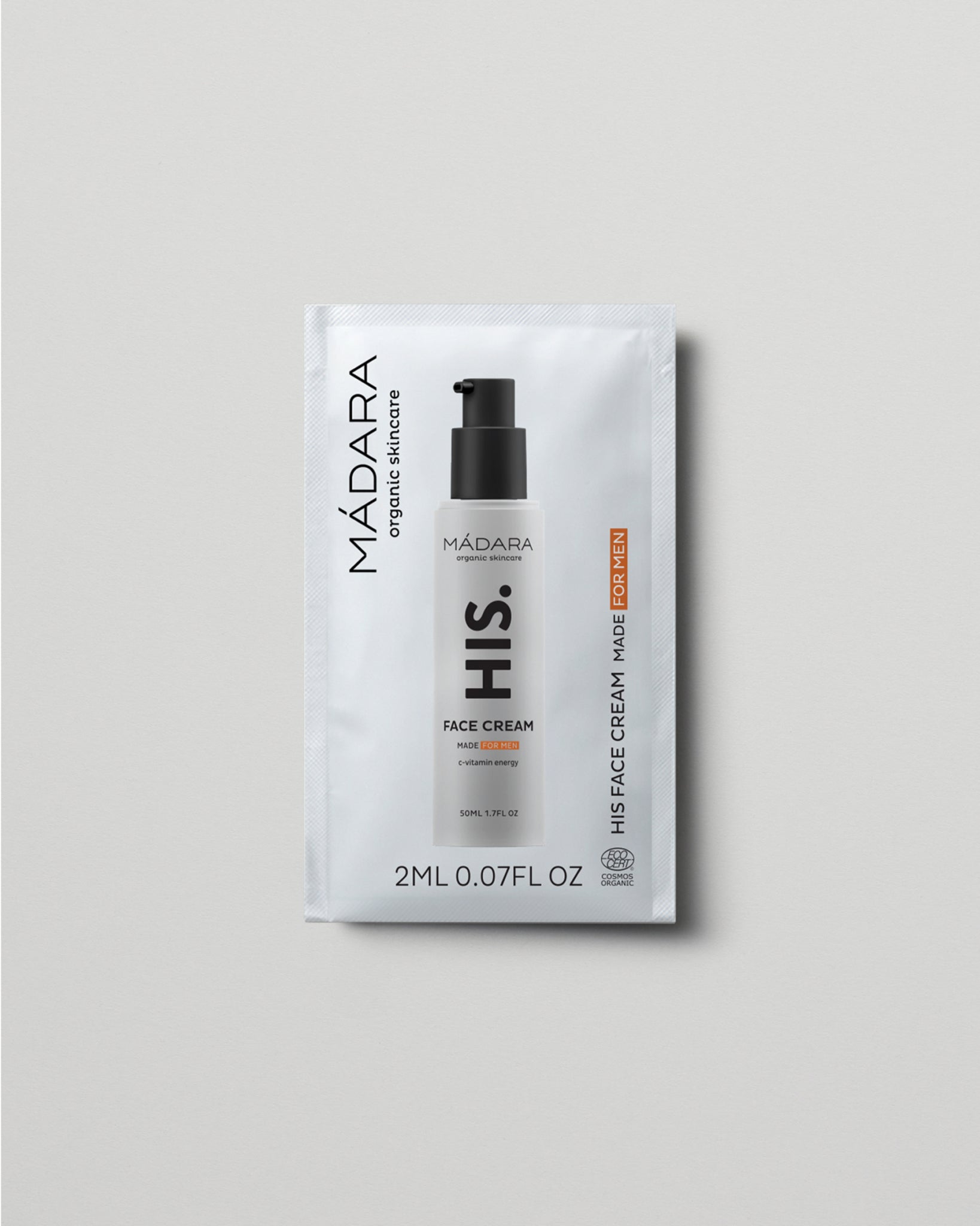 Model wearing MÁDARA Organic Skincare face cream for men 2ml sample SC5003 2 face cream on skin; close-up portrait shows natural application results.