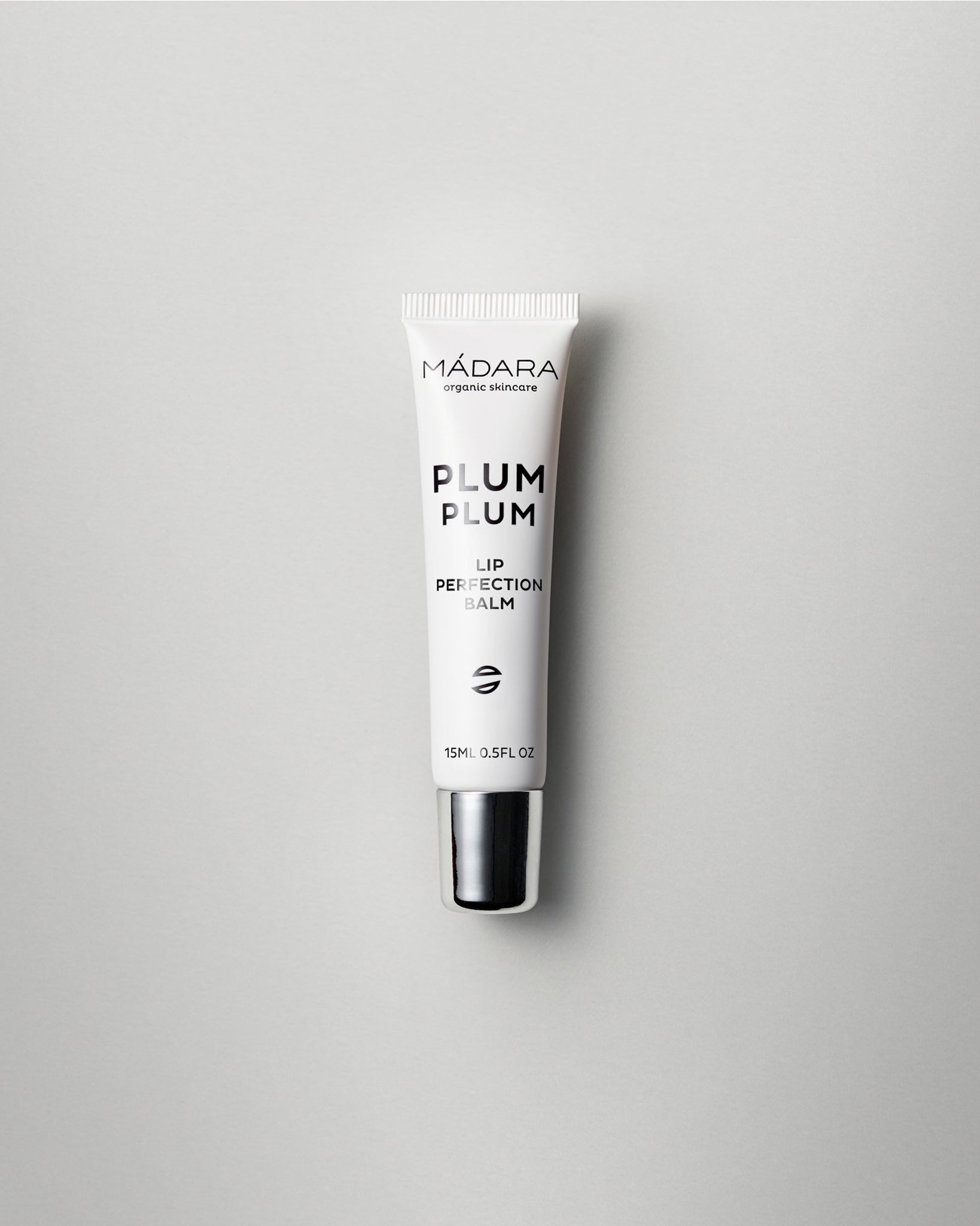 MÁDARA Organic Skincare plum plum lip balm A2291 balm product photo on plain background.