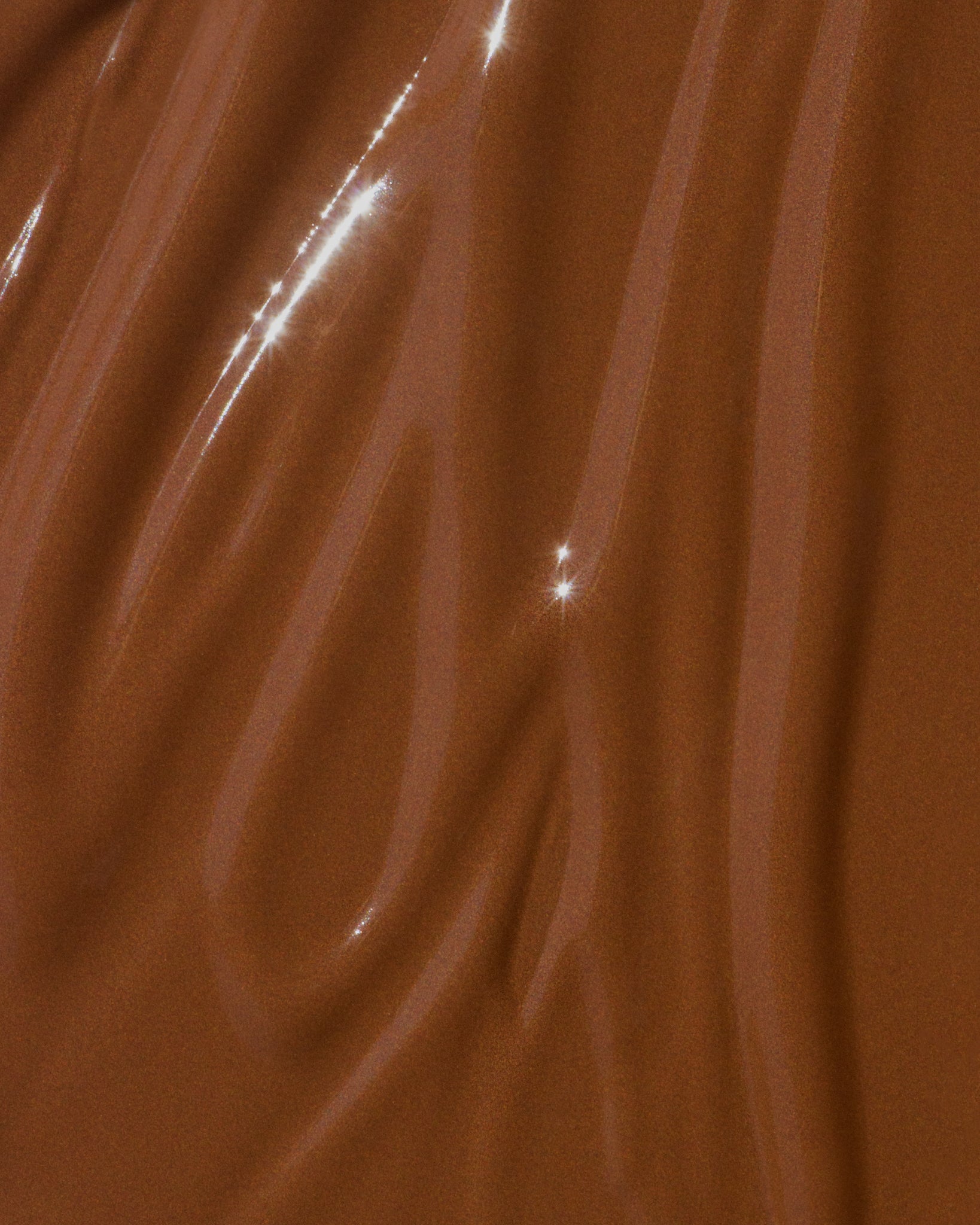 Texture close-up of MÁDARA Organic Skincare skin equal chestnut A6067 �swatch demonstrates consistency and finish.