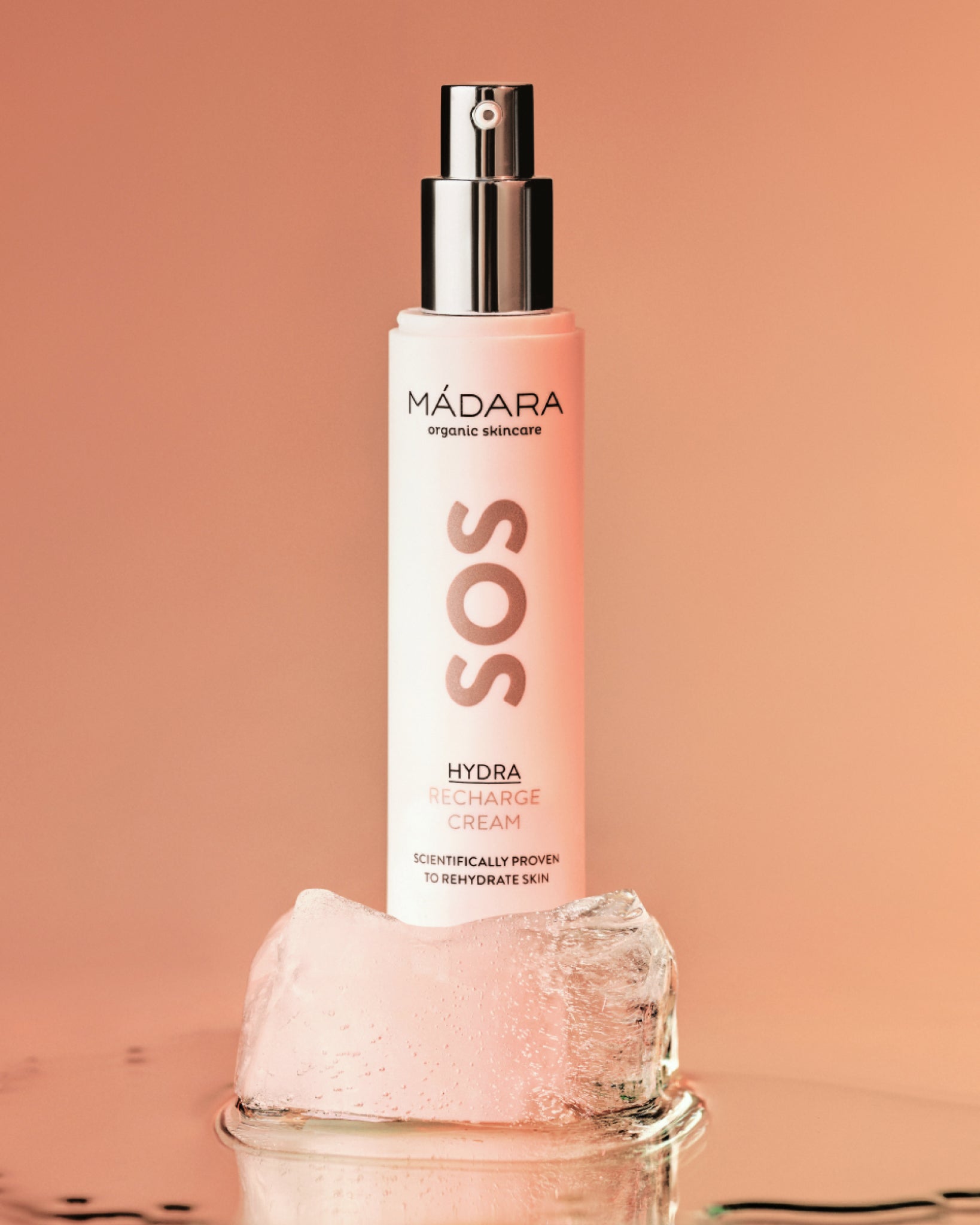 Model wearing MÁDARA Organic Skincare hydrating organic face cream A3011 face cream on skin; close-up portrait shows natural application results.