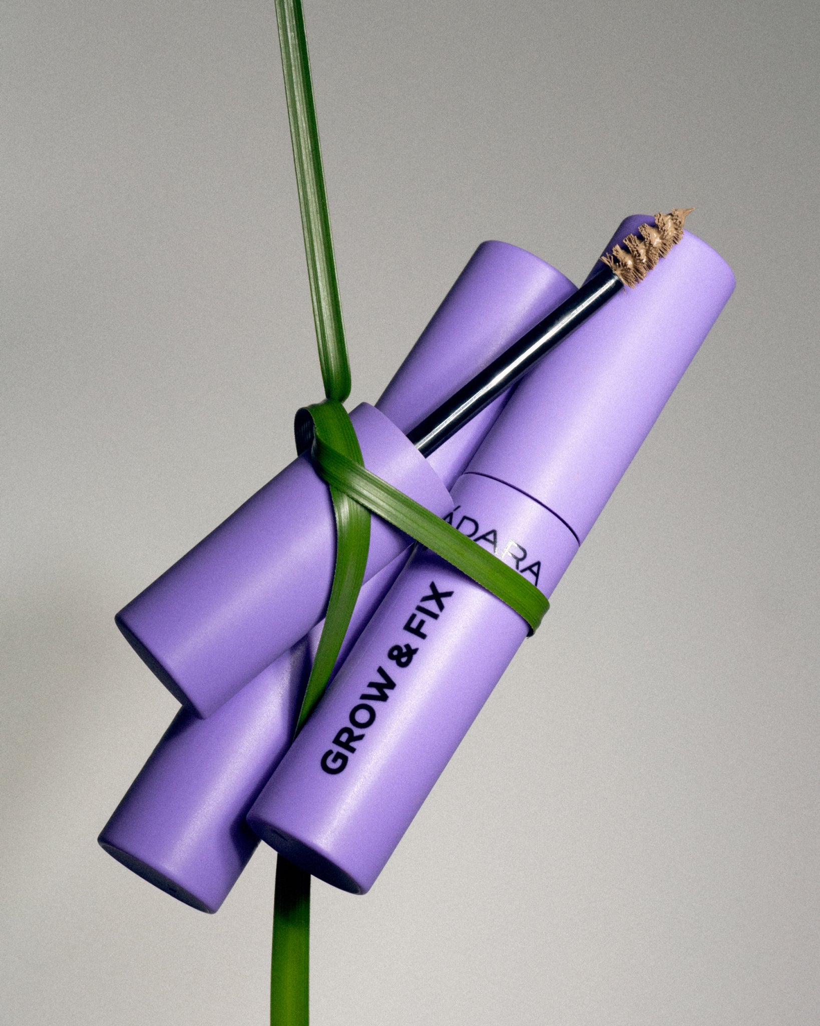 MÁDARA Organic Skincare tinted brow serum A6703 serum product photo on plain background.